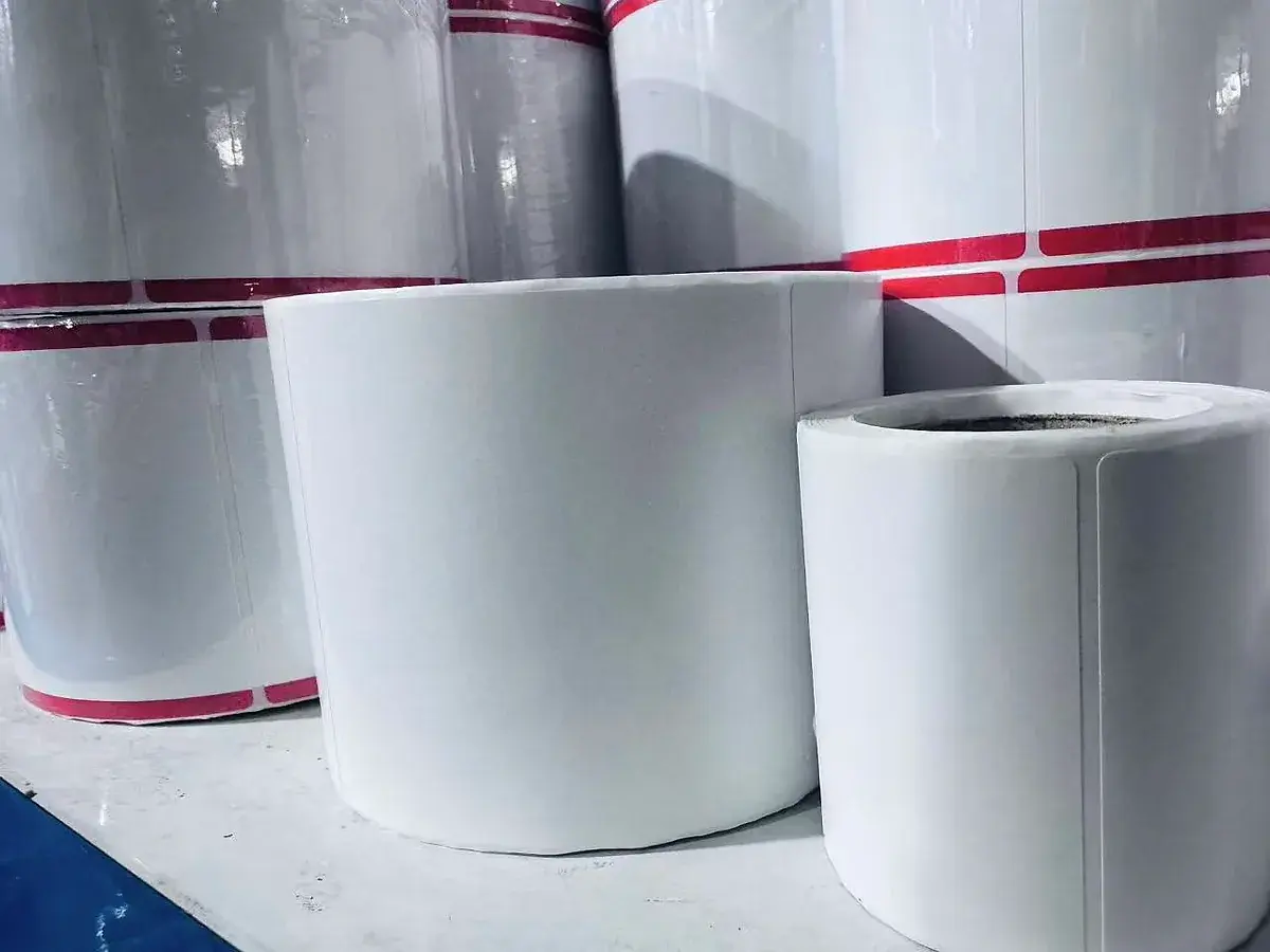 Real rolls of custom adhesive labels prepared for industrial use